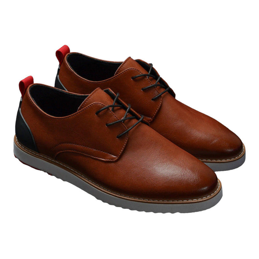 Brown leather shoes with black laces on a white background